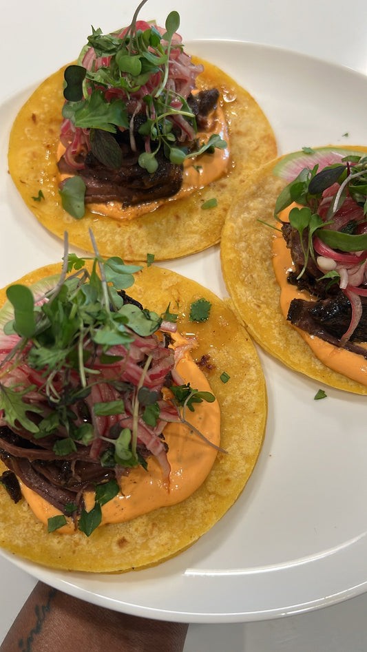 Jerk-Braised Short Rib Tacos with Red Pepper Crema